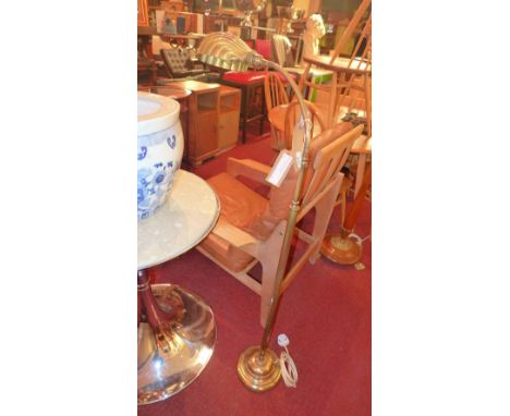 An early 20th century brass lamp with shell form shack on adjustable supports and one other standard lamp (2)