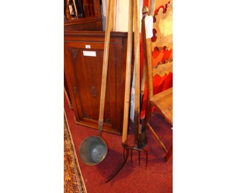A collection of vintage agricultural tools