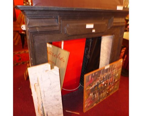 A contemporary fire surround having a painted faux marble finish with white marble inserts 