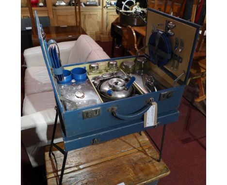 A c1930s classic car sirram picnic set in a blue case with folding tray table, fitted with plated teapot and other items