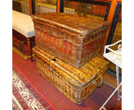A pair of vintage wicker hampers with leather binding 