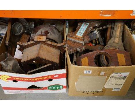A large collection of vintage clocks and clock parts contained within two boxes. 