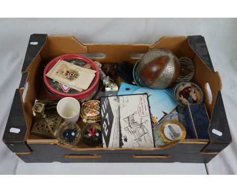 A box of mixed collectables to include glass paperweights, silk postcards, brass candlestick and football programmes. 