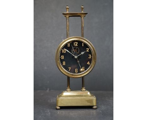 A vintage brass cased gravity clock. 