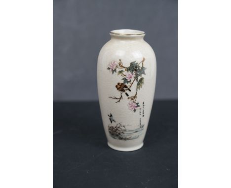 A small Chinese ceramic vase with birds and flowers signed with character mars to the body.13 cm in height. 