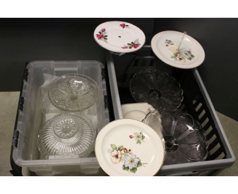 A large collection of vintage glass and ceramic cake plates and cake stands. 
