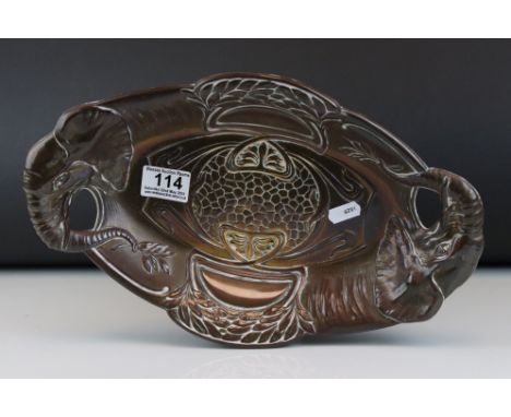 A brass Art Nouveau tray with elephant handles. measures approx 35cm. 