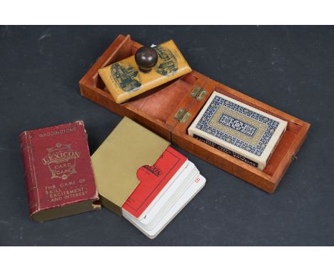 A box of mixed collectables to include a Waddingtons Lexicon card game and a cribbage board. 