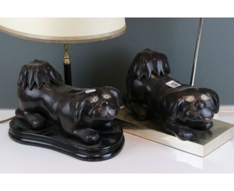 Pair of Japanese lacquered dogs, being used as lamp decorations, on two twin headed lamps. 