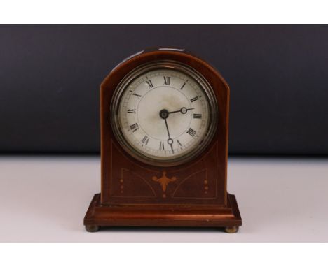 An early 20th century mahogany dome topped mantle clock with string inlay decoration. 