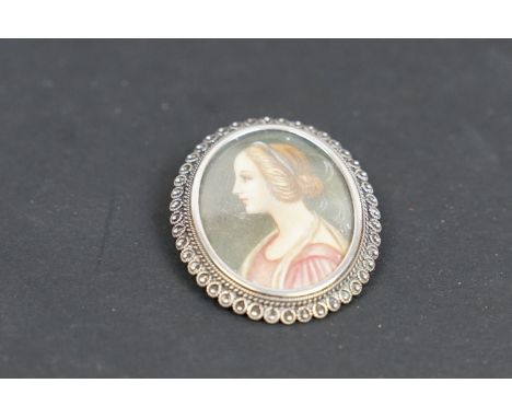 A continental 800 silver brooch with female portrait to centre. 