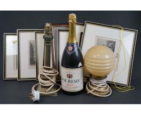 A box of mixed collectables to include a brass Corinthian column table lamp and a bottle of Pol Remy Brut. 