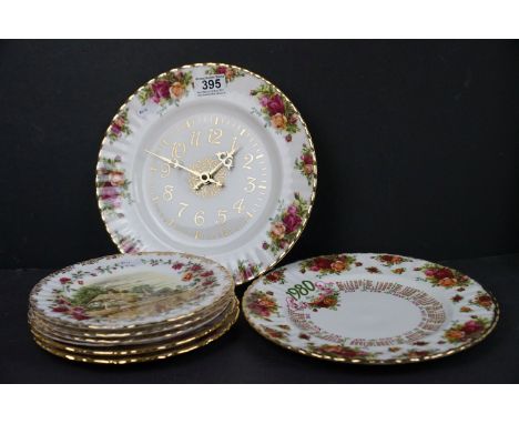 A collection of Royal Albert cabinet plates together with a Royal Albert wall clock. 