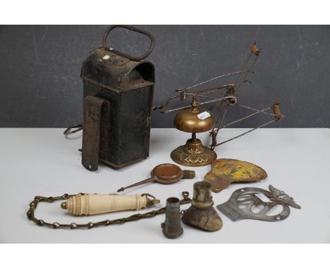 A box of mixed collectables to include a vintage brass shop counter bell and a signal lamp. 