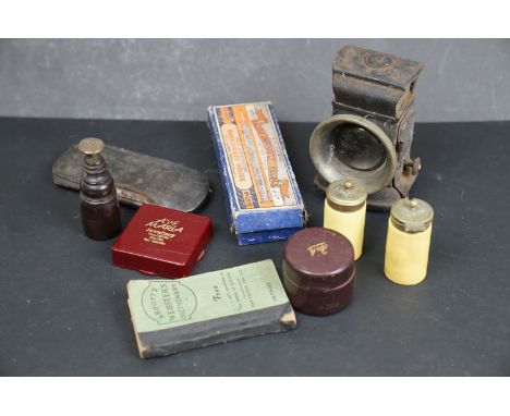 A box of mixed collectables to include a vintage bicycle lamp and a pocket travelling inkwell. 