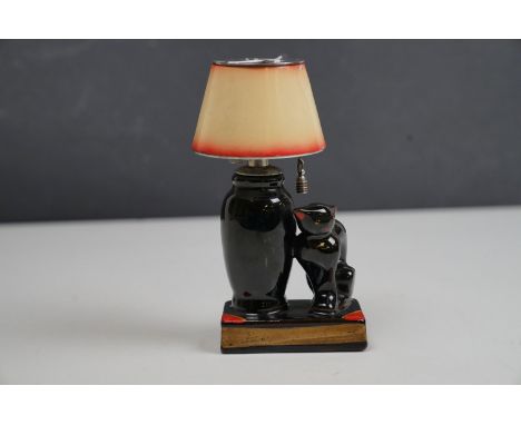 A vintage ceramic table lighter in the form of a lamp with black cat. 