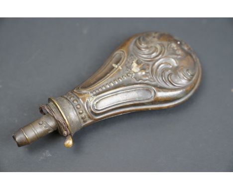 A vintage brass powder flask with Art Nouveau decoration. 