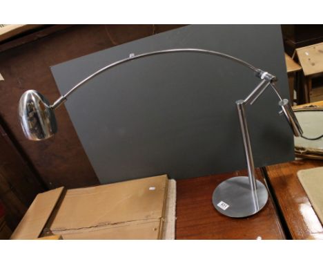 A retro chrome plated counter balanced lamp. 