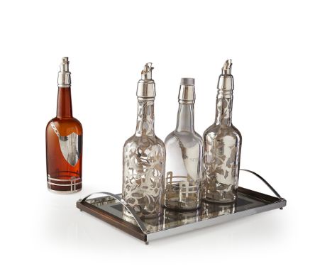 FOUR CONTINENTAL GLASS AND SILVER DECANTERS CIRCA 1930S comprising two glass decanters with mallet shaped bodies and pourers 
