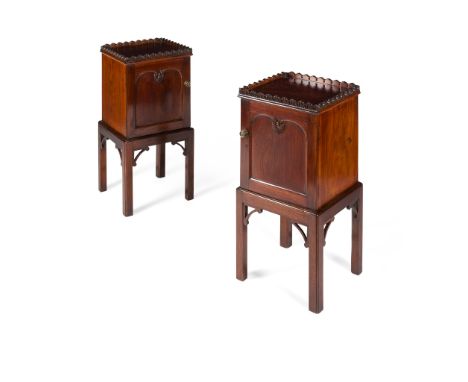 PAIR OF ANGLO INDIAN PADOUK BEDSIDE CHESTS 19TH CENTURY the square tops with foliate carved galleries, above arch panel doors