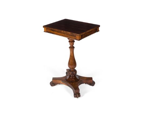 Y REGENCY ROSEWOOD LAMP TABLE EARLY 19TH CENTURY the rectangular top above a baluster leaf carved support, on a concave quadr