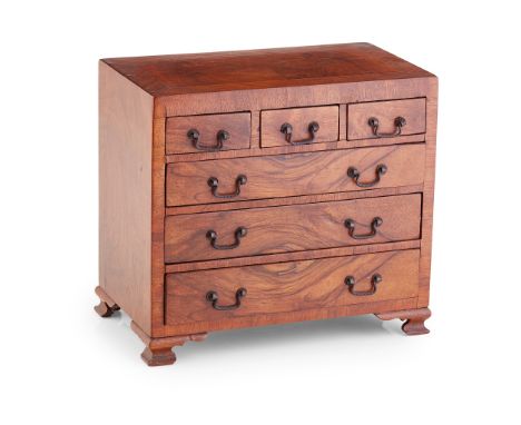 TWO MINIATURE WALNUT CHESTS OF DRAWERS 19TH/ EARLY 20TH CENTURY the first with a crossbanded top above three short and two lo