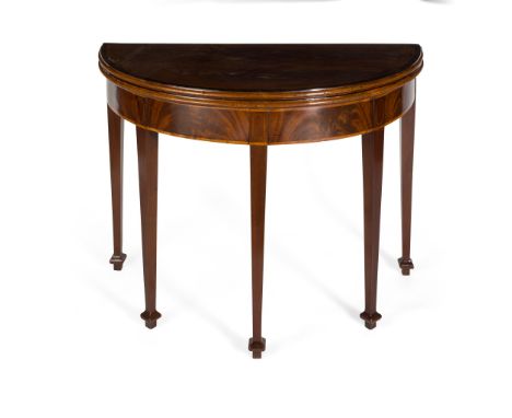 GEORGE III MAHOGANY DEMI-LUNE CARD TABLE 18TH CENTURY the crossbanded fold-over top opening to a green baize playing surface,