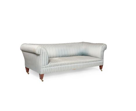 HOWARD &amp; SONS CHESTERFIELD SOFA EARLY 20TH CENTURY with a low back and scrolled arms, on square tapered mahogany legs wit