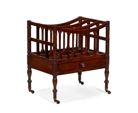 REGENCY STYLE MAHOGANY EBONY STRUNG CANTERBURY 19TH CENTURY with four divisions and ring turned corner supports, above a base