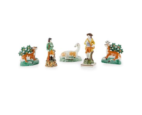 THREE STAFFORDSHIRE PEARLWARE FIGURES OF DEER LATE 18TH/EARLY19TH CENTURY comprising a pair of spotted deer, each modelled re