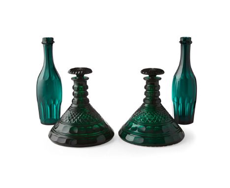 PAIR OF REGENCY GREEN GLASS SHIP'S DECANTERS MID 19TH CENTURY each with bands of ring, oval and diamond cut decoration, with 