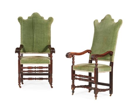 PAIR OF WILLIAM AND MARY STYLE WALNUT ARMCHAIRS 19TH CENTURY the high backs with shaped cresting above rectangular padded sea