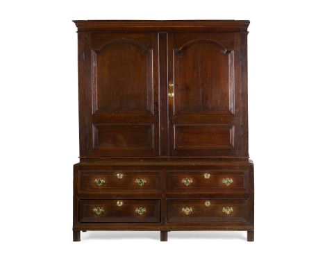 GEORGIAN OAK LIVERY CUPBOARD 18TH CENTURY the moulded cornice above a pair of arch moulded panel doors opening to hanging spa