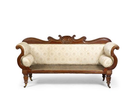 A VICTORIAN THREE SEATER SOFA with silk brocade upholstered decoration and two bolster cushions, standing on fluted legs term