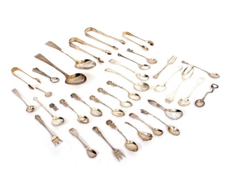 A COLLECTION OF SILVER AND WHITE METAL CUTLERY to include Georgian serving spoons, sugar tongs, decorative pickle forks, cond