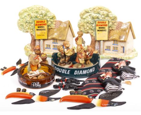 A COLLECTION OF GUINNESS CARLTONWARE ADVERTISING ITEMS to include flying toucans, double diamond ashtray and ceramic wall pla