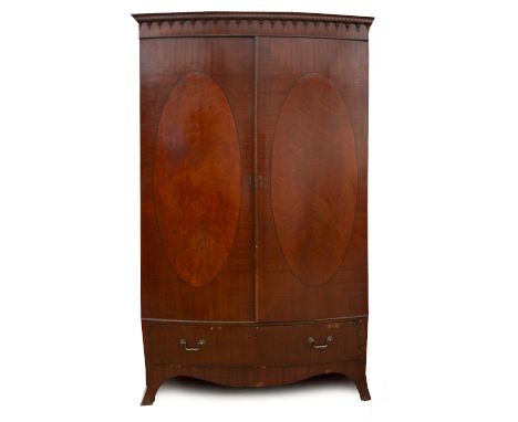 A MAHOGANY BOW FRONTED TWO DOOR WARDROBE  with drawer beneath and outswept bracket feet, 122cm wide x 50cm deep x 198cm high