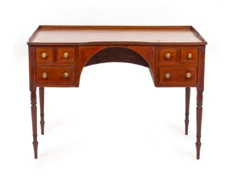 A 19TH CENTURY MAHOGANY WRITING DESK with a galleried top over six drawers, standing on turned tapering legs terminating in s