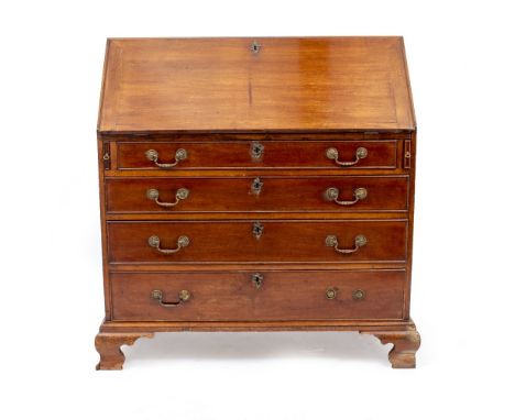 A GEORGE III MAHOGANY BUREAU the fall front enclosing a fitted interior with drawers and pigeon holes within, and over four l