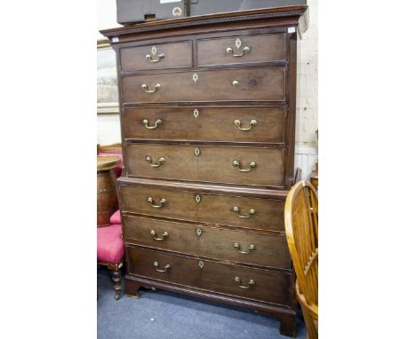 A GEORGIAN MAHOGANY CHEST ON CHESTwith two short over six long drawers with swan neck brass handles on bracket feet. Measures