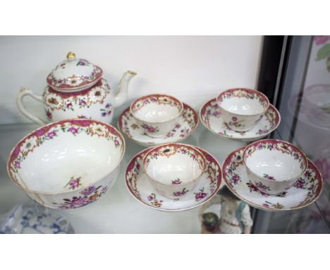 AN 18TH CENTURY CHINESE FAMILLE ROSE PORCELAIN TEA SETdecorated with flowers and insects consisting of a teapot 14.5cm high, 