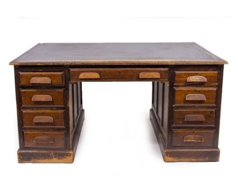A PEDESTAL DESK  with leatherette inset top and various drawers, 152cm wide x 106cm deep x 76cm high