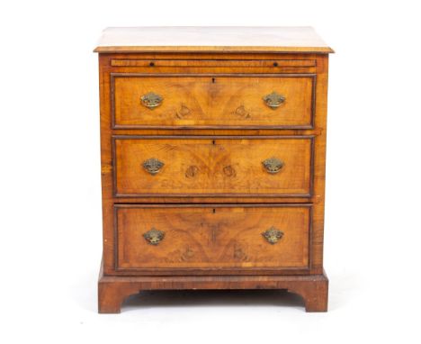 A VICTORIAN WALNUT THREE DRAWER CHEST fitted with a brushing slide, standing on bracket feet, 76cm x 51cm x 90cm high