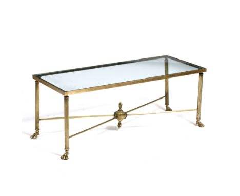 A BRASS RECTANGULAR COFFEE TABLE with glass inset top, reeded legs terminating in paw feet united by an X stretcher with cent