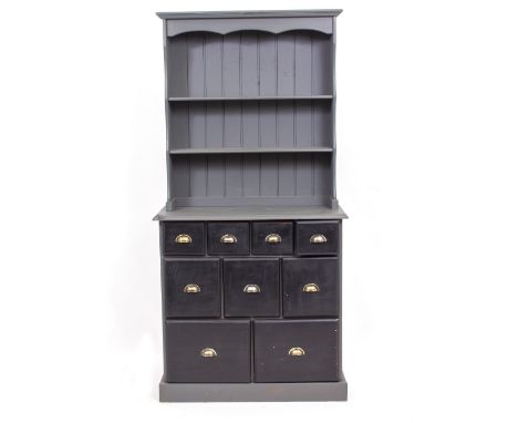 A 20TH CENTURY PAINTED PINE DRESSER with nine drawers of small proportions on a plinth base 89cm x 41cm x 180cm 