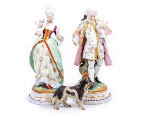 A PAIR OF PARIS PORCELAIN STYLE FIGURES of a lady and gentleman, and a 19th century cold painted bronze of a dog (3)