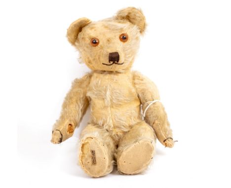 AN EARLY TO MID 20TH CENTURY MERRYTHOUGHT STUFFED TEDDY BEAR 40cm long