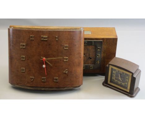 ART DECO CLOCKS - an excellent crossbanded mantel clock on bracket feet, bearing plaque 'Presented to Miss N Wray and Mr F L 