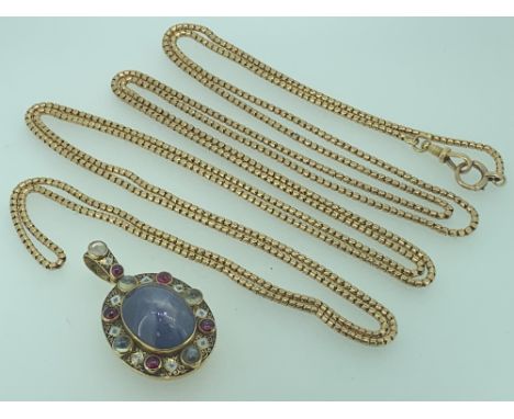 ELIZABETHAN STYLE LOCKET and a 9ct gold muff chain, the locket reportedly fashioned by Liberty, having a large central Indian