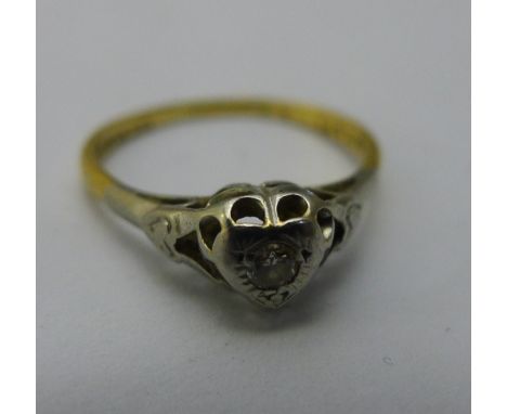 An 18 ct gold diamond solitaire ring (2.3 grammes all in)
